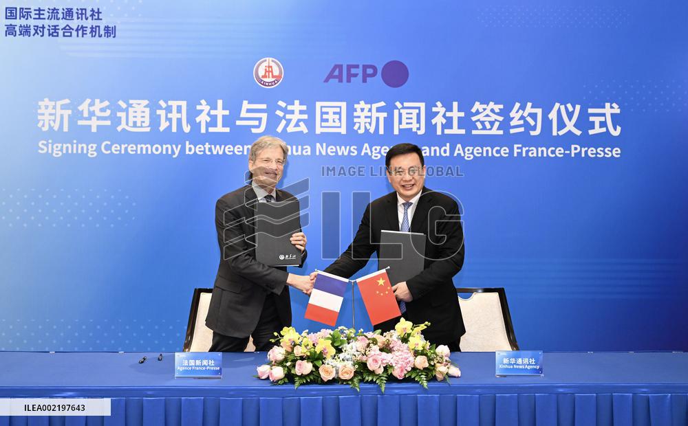 CHINA-BEIJING-XINHUA-AFP-MOU-COOPERATION (CN)