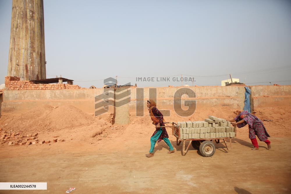 Laborers Work At A Bricks Field In Bangladesh