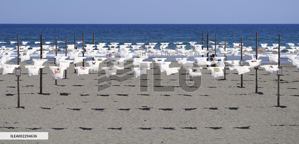 Illustrated T-shirts hang at beach in western Japan