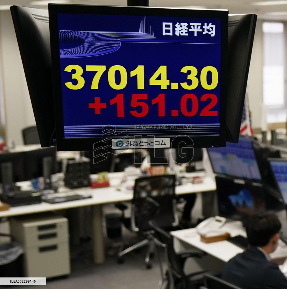 Nikkei index tops 37,000, 1st in 34 years