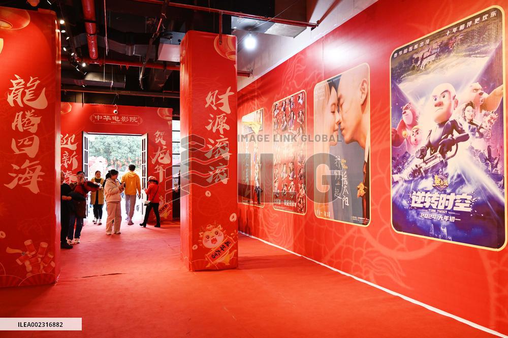 People Wait in Front of Movie Posters for the Lunar Year at A Cinema in Nanning