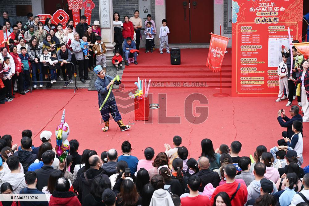 Tourists Watch A Folk Art Performance in Nanning