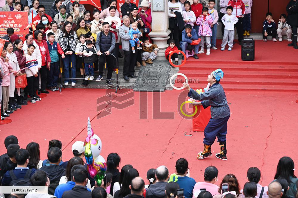 Tourists Watch A Folk Art Performance in Nanning