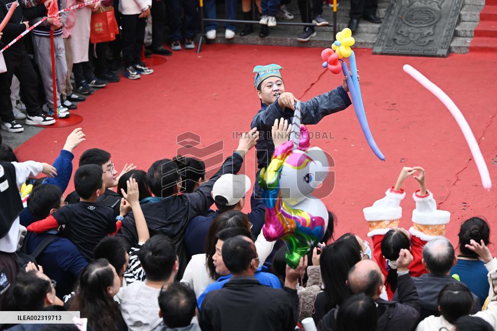Tourists Watch A Folk Art Performance in Nanning