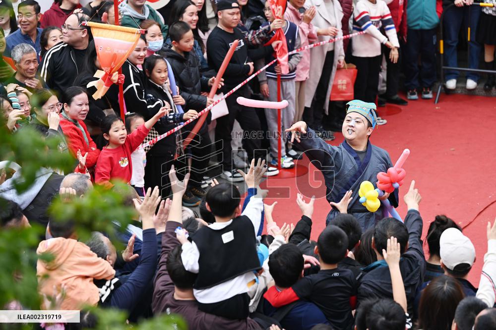 Tourists Watch A Folk Art Performance in Nanning