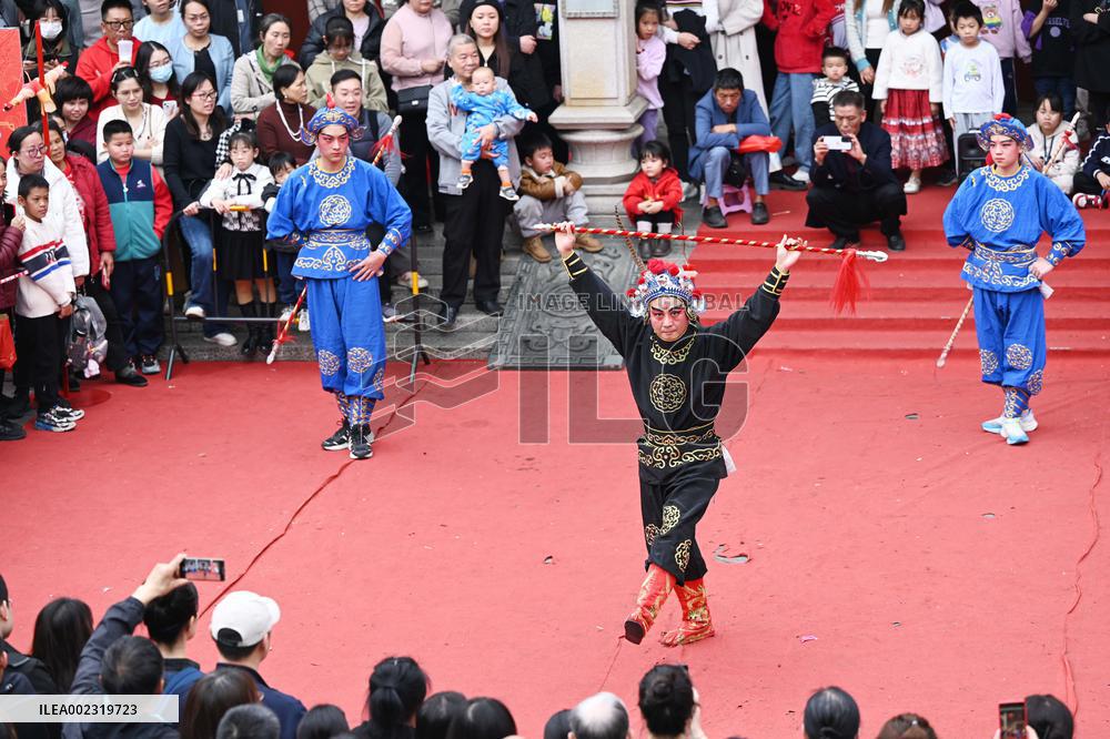 Tourists Watch A Folk Art Performance in Nanning