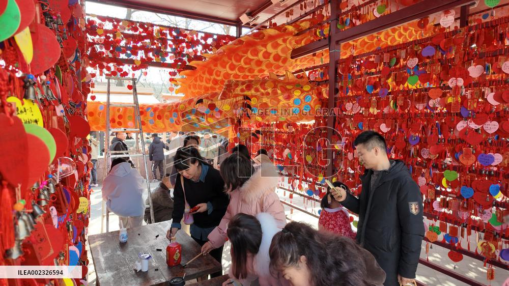 Tourists Visit A Blessing Wall in Xi'an