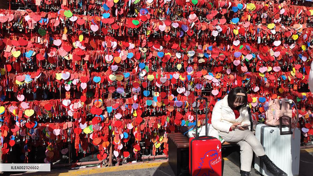 Tourists Visit A Blessing Wall in Xi'an
