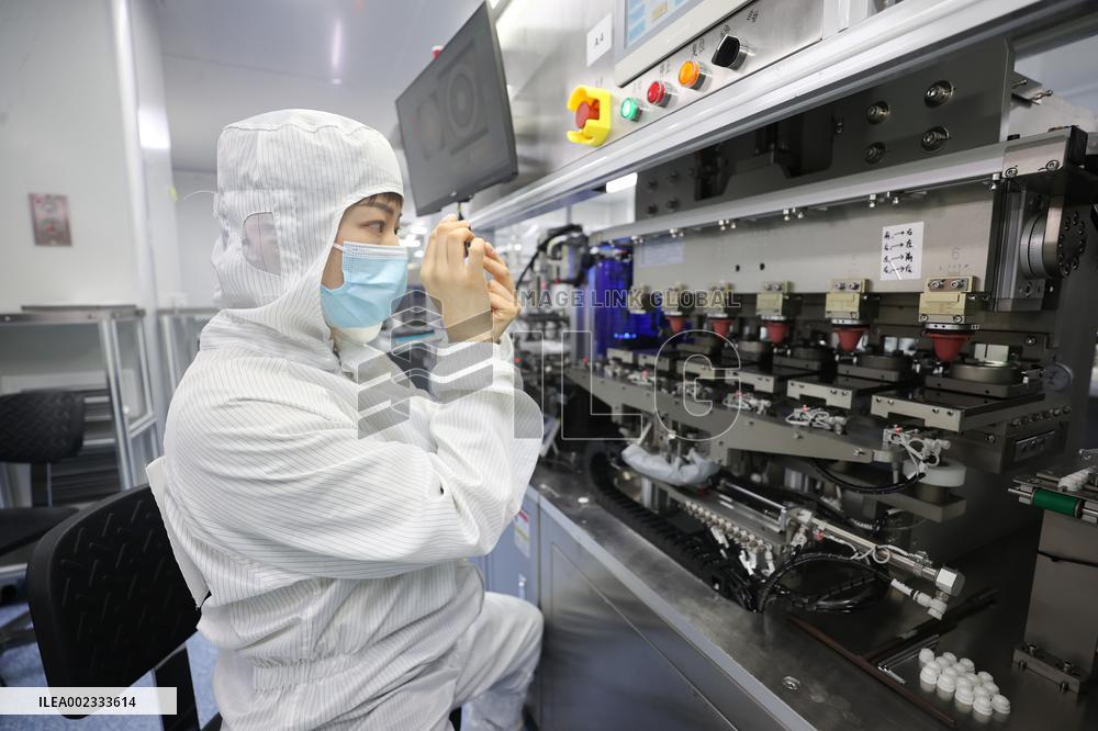 Workers Make Contact Lenses