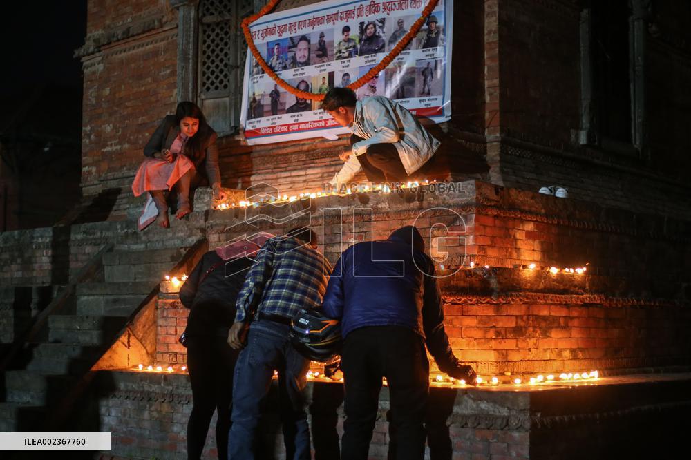 Family Members Of Deceased Nepali Citizen While Fighting For Russia Lights Lamp During A Vigil Ceremony Held In Kathmandu.