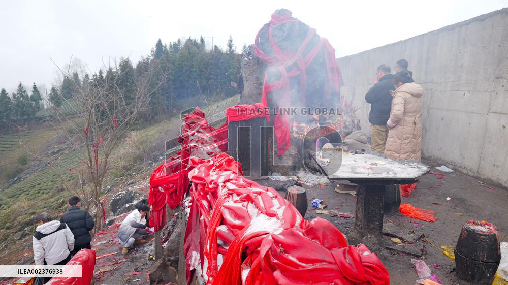 Pilgrims Worship Sacred Stone in Enshi