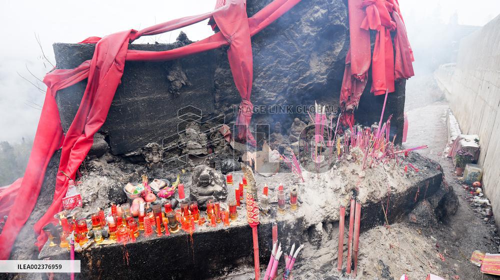 Pilgrims Worship Sacred Stone in Enshi