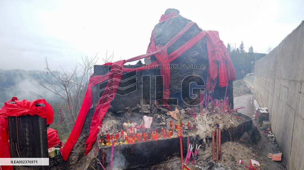 Pilgrims Worship Sacred Stone in Enshi
