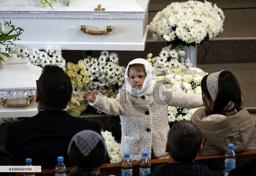 Memorial service for mother and 4mo baby killed in March 2 Russian drone attack on Odesa