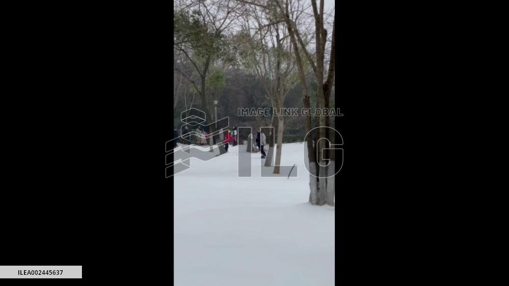 China: Snowboarder Gracefully Glides On Wuhan Slopes