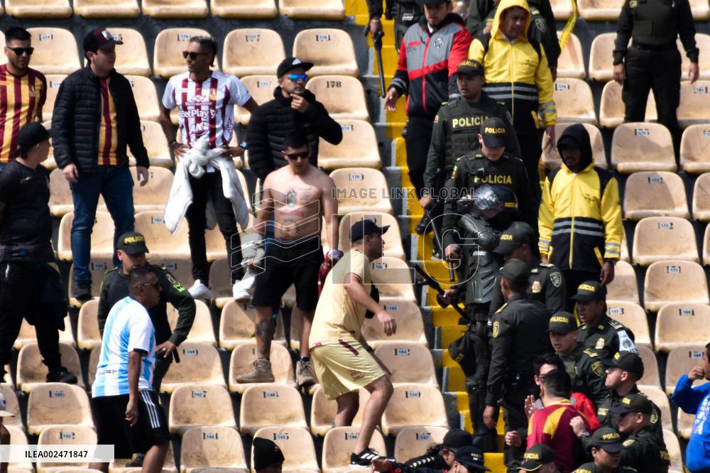 Fans of Deportes Tolima Clash with Santa Fe Fans during Match