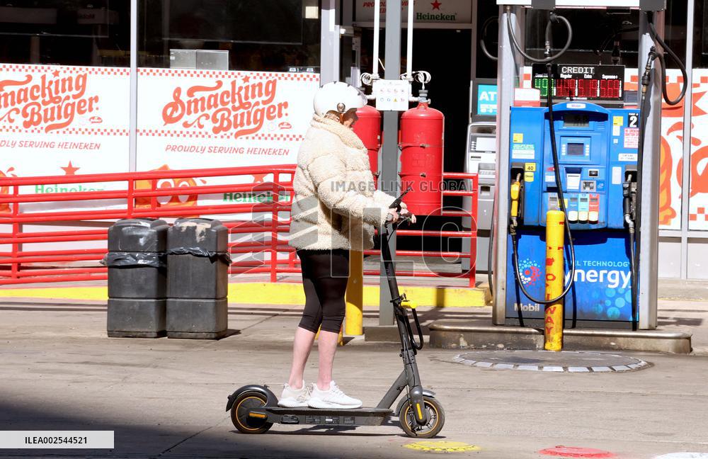Deborra-Lee Furness Riding Her Scooter - NYC