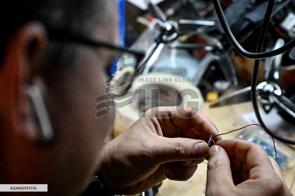 Ukrainian combat drone company soldiers configure FPV drones