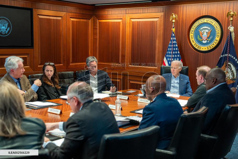 US President Joe Biden meets with members of the National Security Council regarding the unfolding missile attacks on Israel