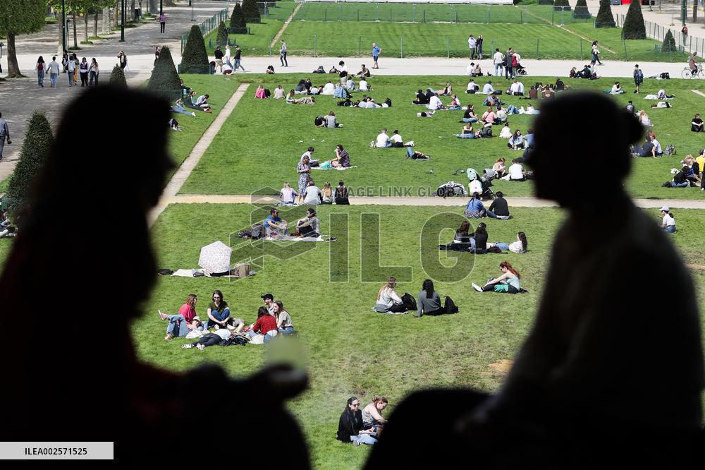 People enjoying the sun in Paris