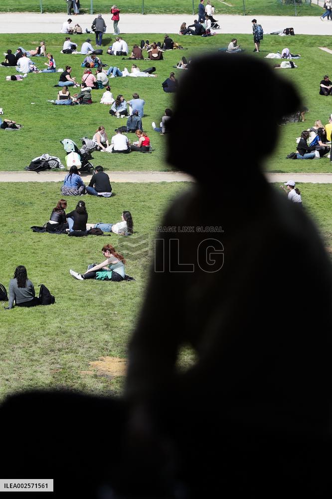 People enjoying the sun in Paris