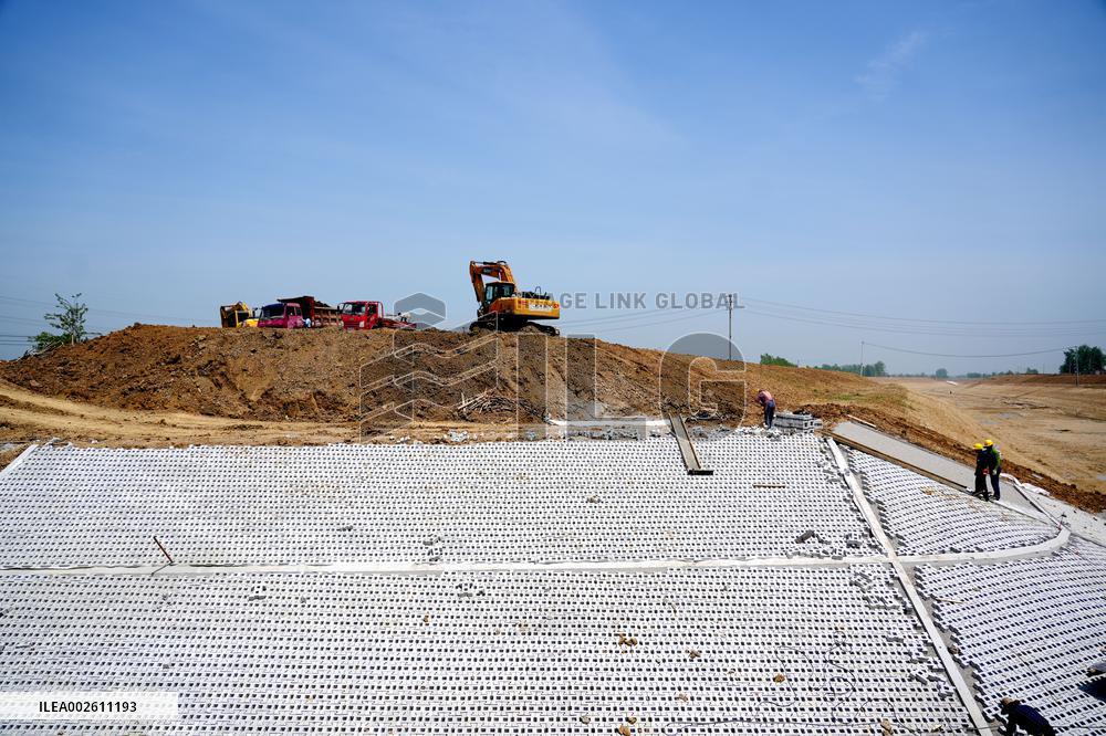 Workers Reinforce Embankments in Suqian