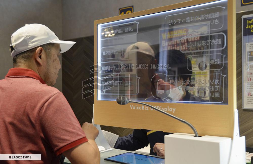 Automatic translation device at rental car shop