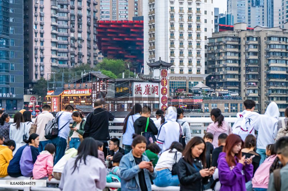 Tourists Gather at Qiansimen Bridge in Chongqing
