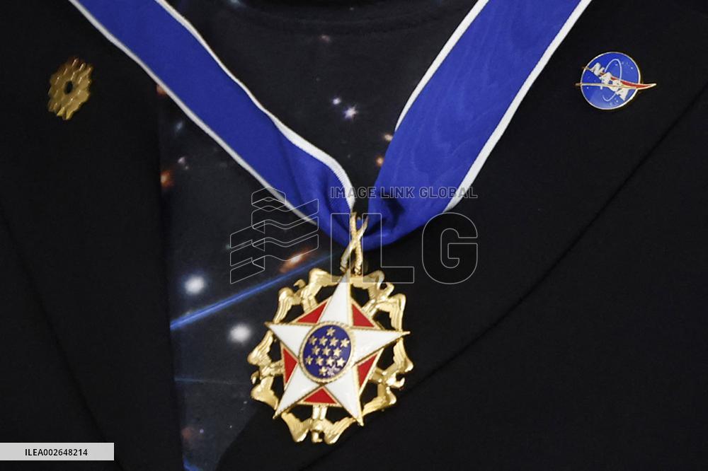 President Biden presents Rigby with the Presidential Medal of Freedom