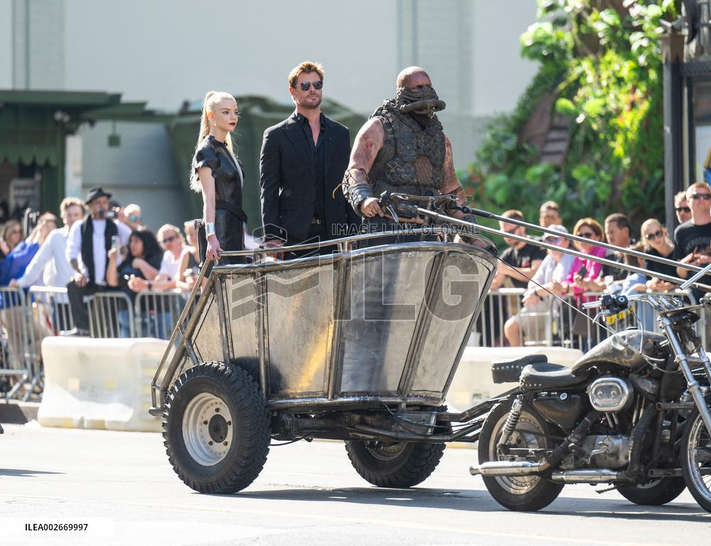 Anya Taylor-Joy and Chris Hemsworth Arrive At Jimmy Kimmel On Mad Max Carriage - LA