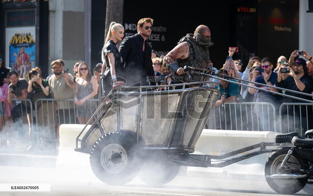Anya Taylor-Joy and Chris Hemsworth Arrive At Jimmy Kimmel On Mad Max Carriage - LA