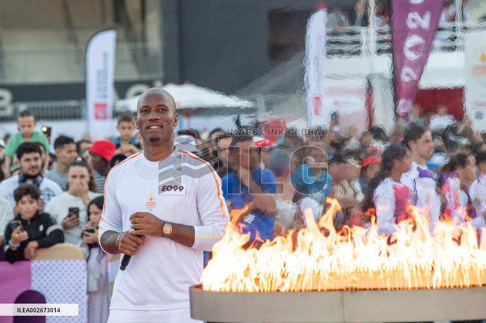 Olympic And Paralympic Torch Relays - Didier Drogba Holds The Olympic Torch