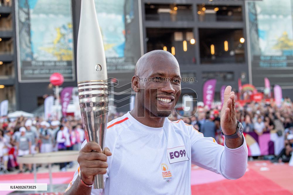 Olympic And Paralympic Torch Relays - Didier Drogba Holds The Olympic Torch