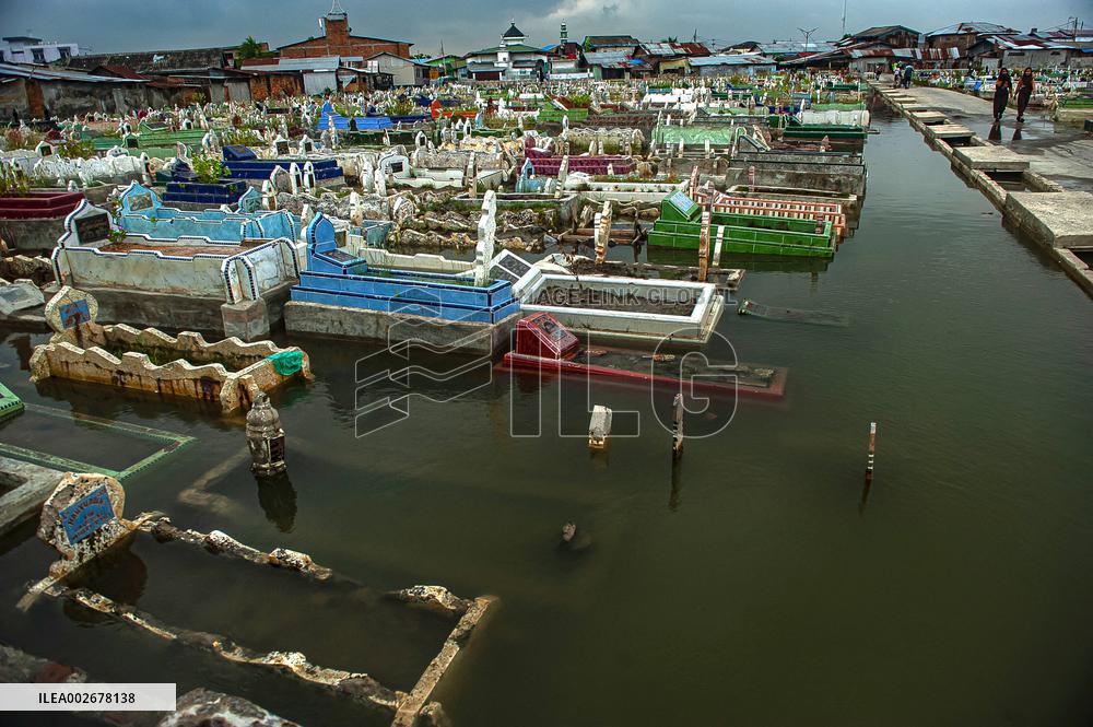 Public Grave Submerged By Tidal Flood - Indonesia