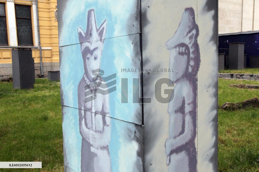 Kevlar protective structures shielding stone women from shelling painted in Dnipro