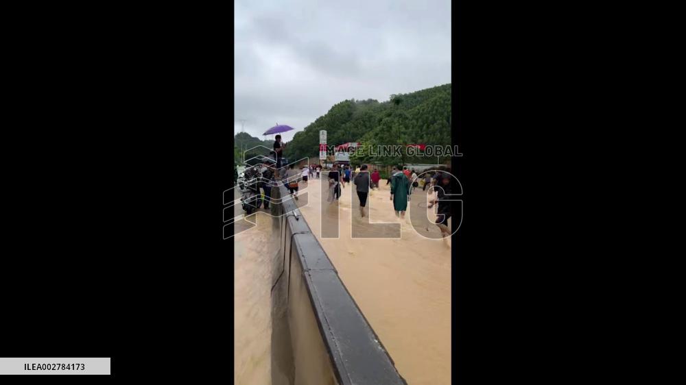 China: People Enjoy Fishing On Flooded Road In Nanning, Guangxi