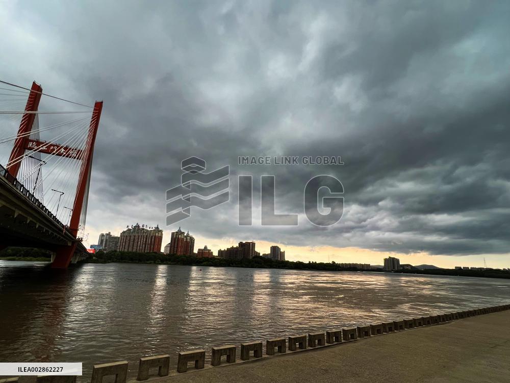 Songhua River Under Dark Clouds in Jilin