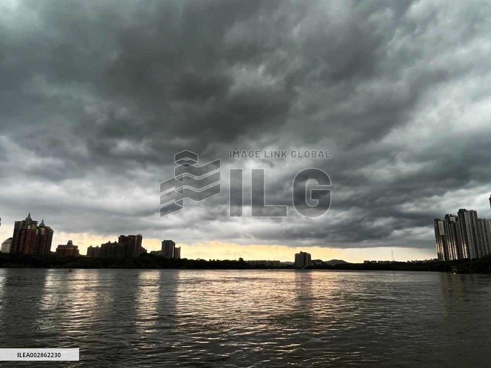 Songhua River Under Dark Clouds in Jilin