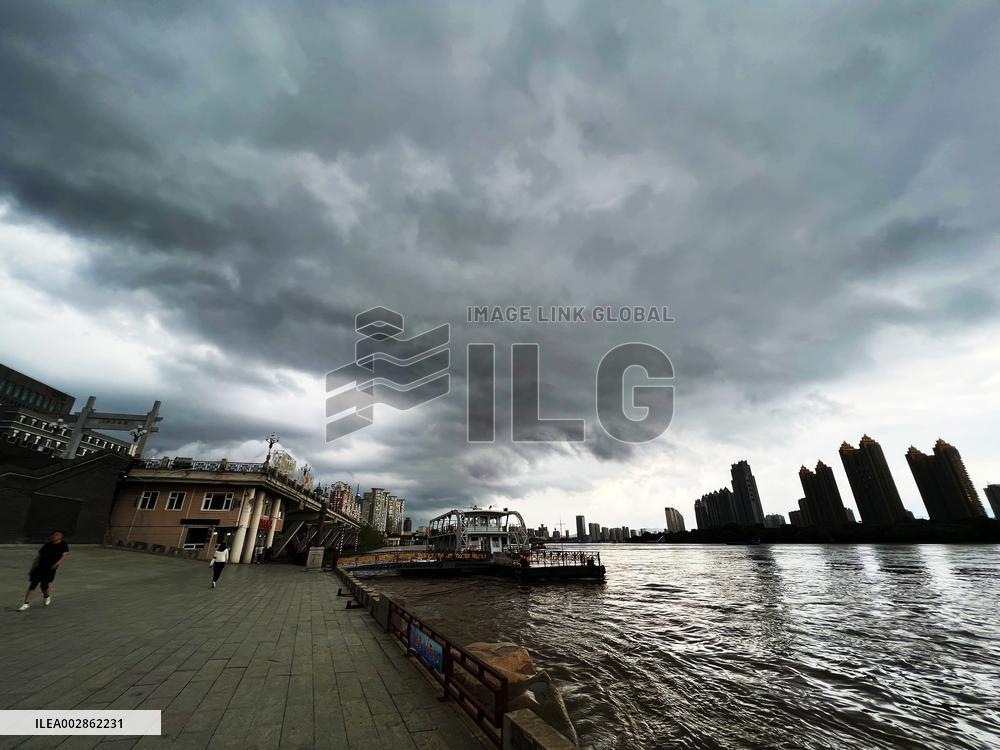 Songhua River Under Dark Clouds in Jilin