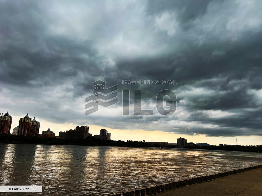 Songhua River Under Dark Clouds in Jilin