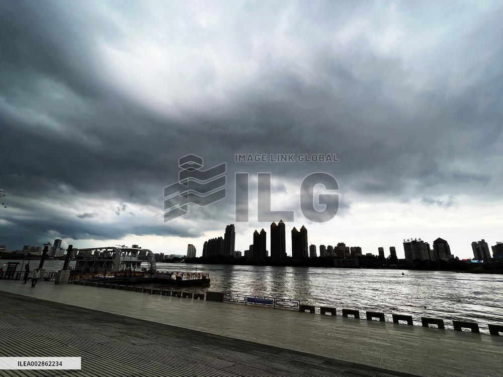 Songhua River Under Dark Clouds in Jilin