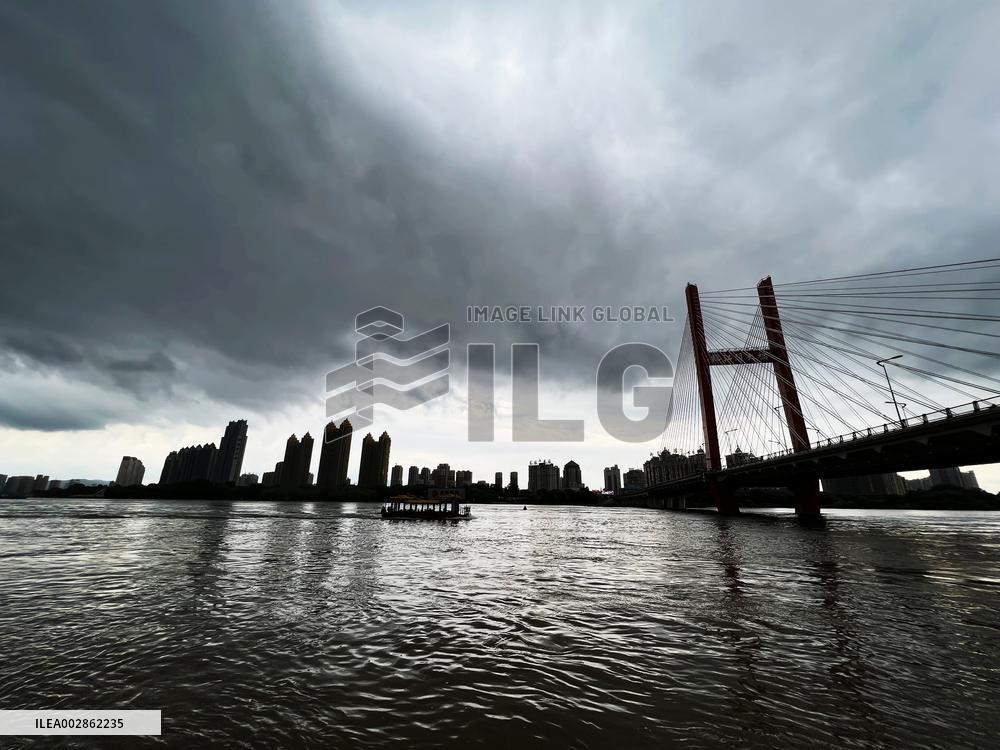 Songhua River Under Dark Clouds in Jilin