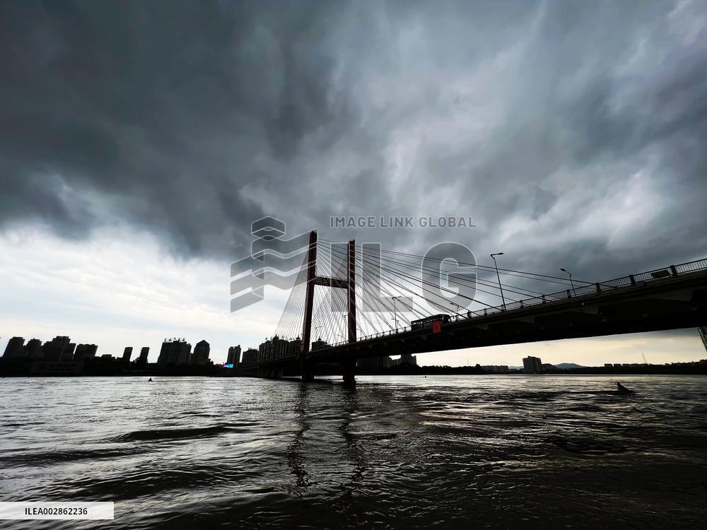 Songhua River Under Dark Clouds in Jilin
