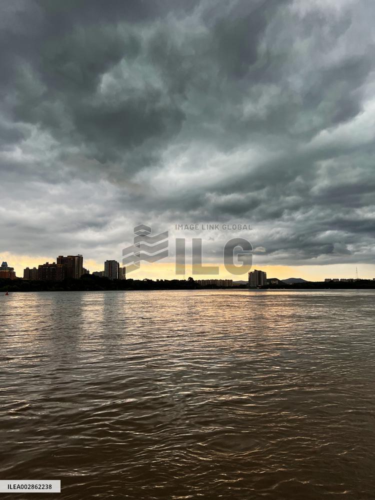 Songhua River Under Dark Clouds in Jilin