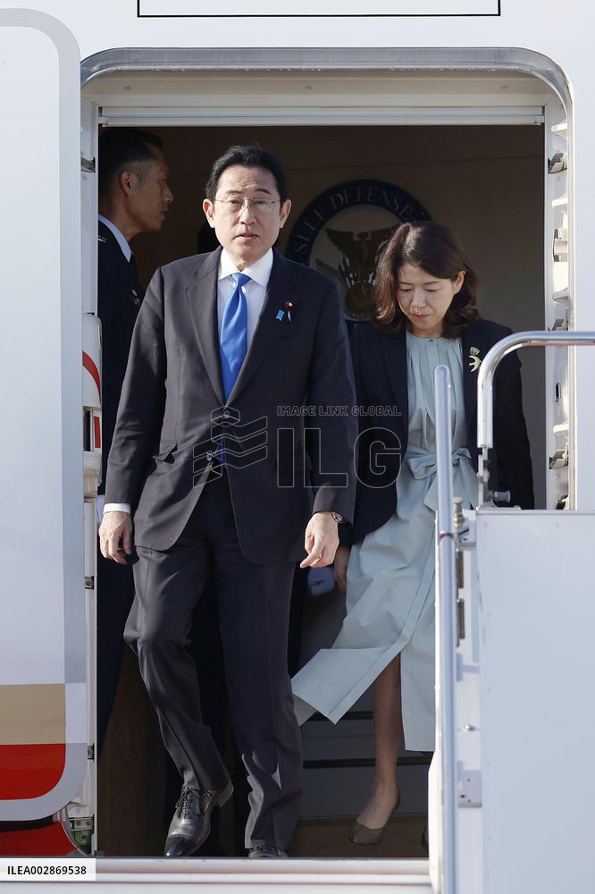 Japan PM returns home