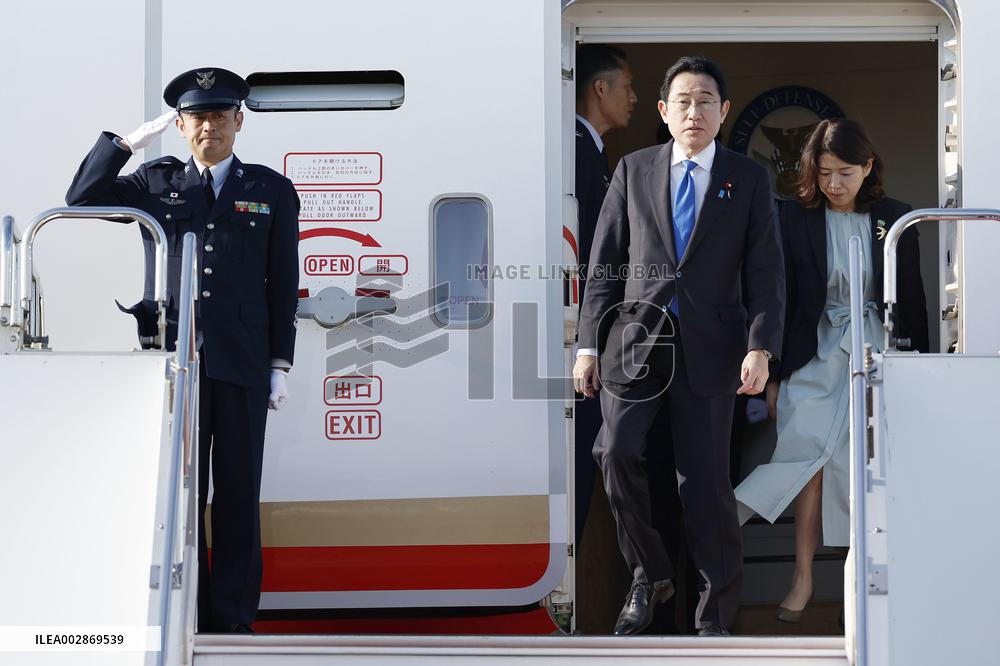 Japan PM returns home