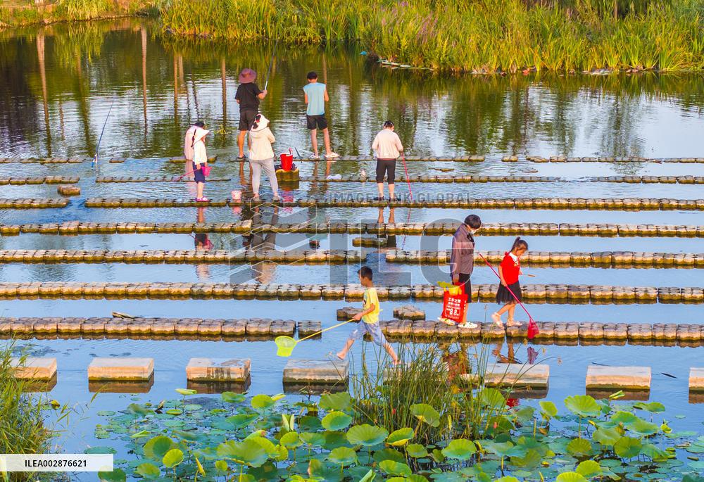 Tourists Enjoy Cool Water in Suqian