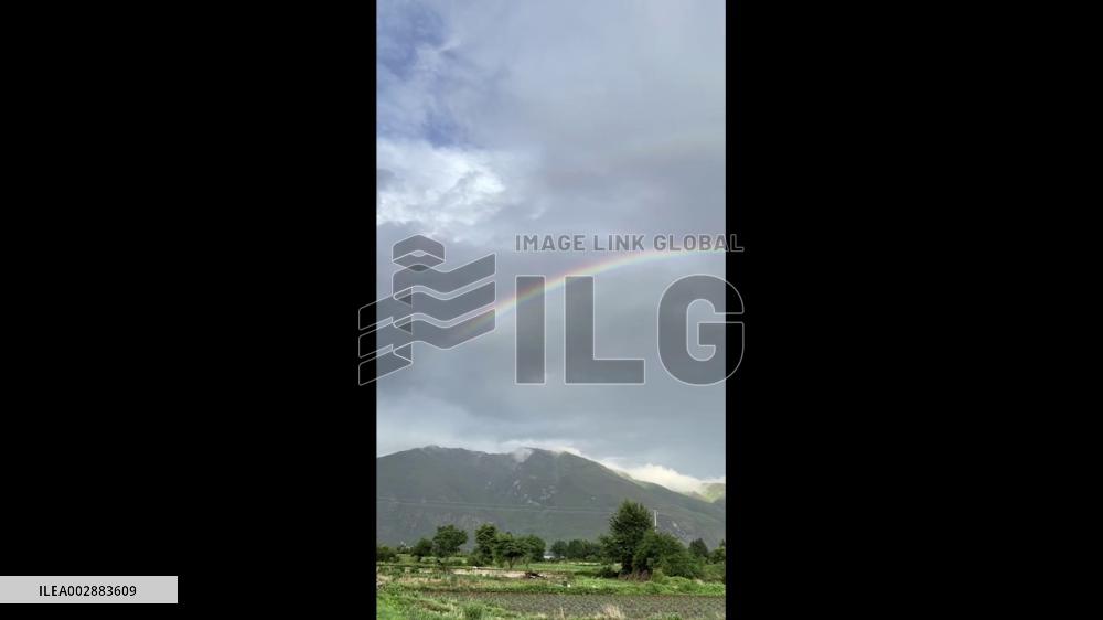 China: Spectacular Double Rainbow Adorns Skies In Lijiang, Yunnan