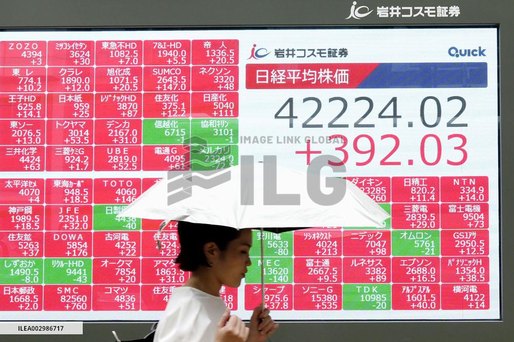 Nikkei ends at new record high
