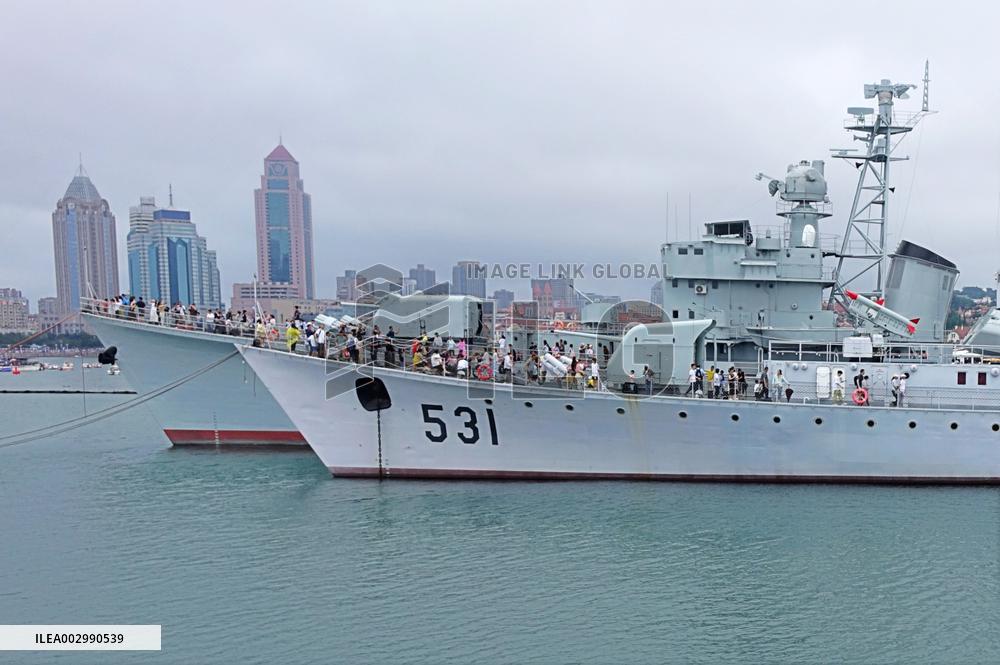 Tourists Visit A Decommissioned Warship in Qingdao